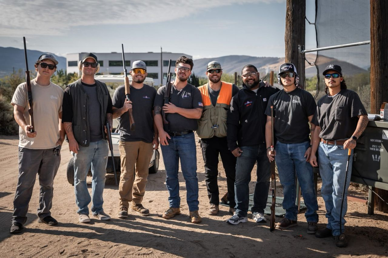 The Pioneer Electric team gathered together outdoors